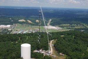 A Tower With A Mountain In The Background